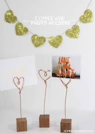 This simple diy project allows you to customize the length and shape of basic copper wire to create a fetching photo holder that fits your growing collection. How To Make Wire Photo Holders Homemade Ginger