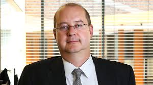 Economist Warren Hogan says the 'unavoidable spending' pressures cited by  Labor should not have a material impact