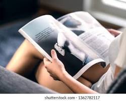 person reading news articles about trends resmi
