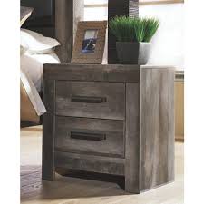 The handles attached to them are golden in color. Edmonton Furniture Store Rustic Gray Night Table B440 Ideal Home Furnishings