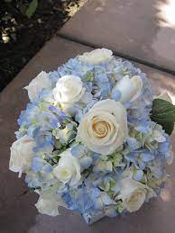 The couple's blue wedding color popped in their flowers. Pin By Dan Spoelstra On Wedding Event Flowers By Island Petals Blue Wedding Bouquet Flower Bouquet Wedding Bridal Bouquet Blue