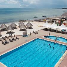 Landmark Mbezi Beach Resort Featuring A Large Swimming Pool Surrounded By Sun Decks Landmark Mbezi Beach Resort Is Located On Mbezi Beach Resorts Resort Beach