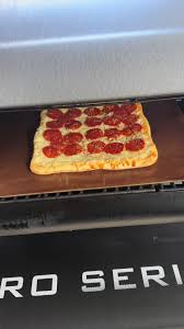 Its not delivery, its a smoked digiorno. #pizza #pelletsmoker #itsnotd...