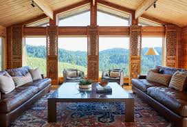 In an inviting lake house boasting a neutral palette, a locally sourced stone fireplace lends a rustic flair to the room's modern touches. Wine Country Rustic Rustic Living Room Other By Bk Interior Design