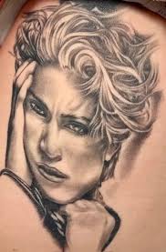 Topeka woman breaks tattoo world record