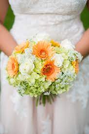 An order of red gerbera daisy wedding bouquets usually includes not only a small bouquet of a bride, but also a boutonniere from the same collection, which makes the image of newlyweds uniform, flowers in a girls hairdress guarantee the perfection of an image, the brides duplicate bouquet will be used for. Orange Gerbera Daisy And Viburnum Bridal Bouquet Daisy Bridesmaid Bouquet Bridal Bouquet Beautiful Bridal Bouquet