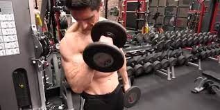 Try combining cheat curling and strict form curls. Athlean X S Jeff Cavaliere Shows Off The Cross Body Reverse Curl