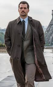 Henry cavill admitted he was 'desperate' to do his own stunts in the mission impossible: Mission Impossible Fallout Henry Cavill Brown Trench Coat Brown Trench Coat Mens Outfits Mission Impossible Fallout