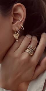 Consider these huggies the perfect everyday earrings — combining the look of dainty gold hoops with a touch of sparkle, they basically give you the best of both worlds (both worlds being gold hoops and classic diamond studs). Heart Hoop Gold Earrings Best Curated Ear Piercing Trend 2021 1 Fab Mood Wedding Colours Wedding Themes Wedding Colour Palettes