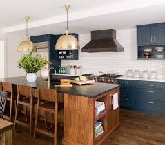 A Navy Kitchen Revival Take A Tour Through Some Of Lauren Liess Favorite Projects And Home Reno Walnut Kitchen Cabinets Navy Kitchen Cabinets Kitchen Remodel