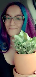 I want to introduce myself. I'm Corey. And, this my snake plant named Lucy  and my spider plant named Little Ms Carolina.