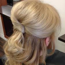 This mother of the bride hairstyles for long hair features beautiful curls that are gathered into a bun over the nape of the neck with the help of pins. 24 Beautiful Mother Of The Bride Hairstyles 2019