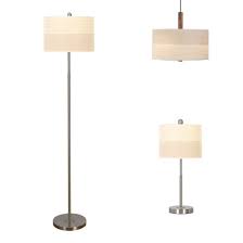 On this floor lamp, a bulb in a cage hangs on a pendant, which is drawn taut over two wheels. China New Best Selling Hotel Lighting Creative Metal Lampshade Table Lamp For Home Decoration Floor Lamp Pendant Lamps China Metal Lamp Table Lamp