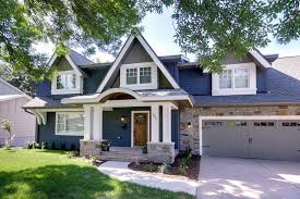 These farmhouse exterior colors are the definition of classic. Home Exteriors Take Color Cues From Stone