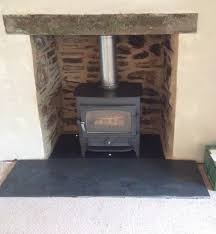 Stone cladding is a thin layer of real or simulated stone applied to a building or other structure made of a material other than stone. Removing A Stone Fireplace Wood Burning Stove Installation From Kernow Fires