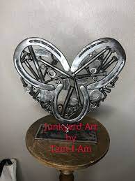 Junkyard Art By Tam I Am Repurposed Horseshoes Along With Various Nuts Bolts And The Like Welded Together To Make Piec Scrap Metal Art Metal Art Scrap Metal