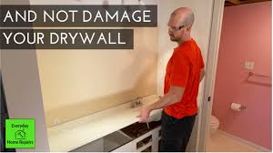 For mounting screws, you can pry the vanity away from the wall and insert wood shims. How To Remove A Bathroom Vanity And Vanity Top Youtube
