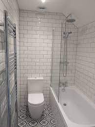 Contrast grey grout with white tiles looks wonderful, especially if you decided to use subway tiles in your shower area. Bathroom With White Metro Tiles And Grey Grout