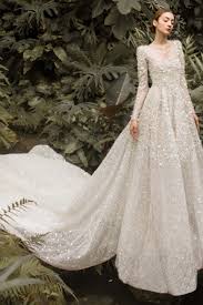 But from the back, it's the long. 2021 New Long Sleeves Halter Sequined Tulle Wedding Dress With Long Train