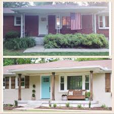 Ranch style house with white brick exterior, black shutters, grey shingle roof, natural stone walkway, and natural wood front door. Before And After Brick Ranch Painted White Wood Shutters Added And Porch Updated Brick Ranch Houses House Exterior Home Exterior Makeover
