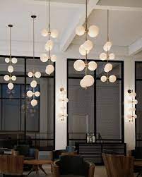 These globe lighting fixtures cast a magnificent pattern and would be perfect mood lighting in a lexi studioworks light fixtures are created by alisha marie boyd, an award winning canadian artist the team focuses on high quality materials such as solid brass and blown glass. Modernrail Pendant Living Room Lighting Design Geometric Chandelier Tech Lighting