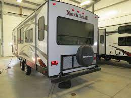 Travel trailers available for your short and it has two queen beds with heated mattress. Outdoor Champs Rv On Twitter Check Out The New Flip Up Rear Storage Rack On Heartlandrvs North Trail Caliber Editions Convenient