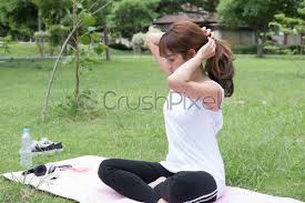 Hair are one of the most essential part of your personality, many people don't recognize it but it is highly essential to work on. Young Asian Female Woman Ties Her Hair In A Ponytail Stock Photo Crushpixel