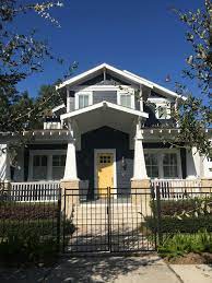 Both colors are very contrast, but they work together as a design. Love The Dark Slate Blue Siding With The Bright Yellow Door Craftsman Bungalow Craftsman Bungalows Craftsman Exterior House Front