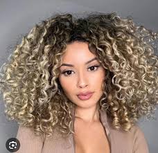Who is a good hair stylist for curly hair in Greeley?