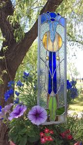 Transform your outdoor or indoor space with style and ease. This Outdoor Garden Stake Has Been Created By Tristans Stained Glass Designed With A Variaty Of Beaut Stained Glass Flowers Stained Glass Stained Glass Panels