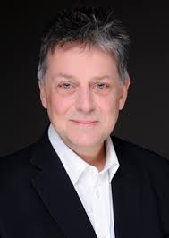 Jonathan Rathbone orchestrates the performance of The Requiem by  Christopher Wood