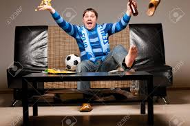 Who is your premier league team after? Soccer Fan On Sofa Stock Photo Picture And Royalty Free Image Image 13799783