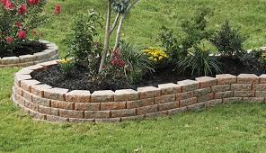 Lay bricks and blocks onto a solid foundation to create an effective garden wall. 10in Retaining Wall Pavestone Creating Beautiful Landscapes