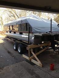 Removing Boat From Bunk Trailer On Land 598773 Pontoon Boat Fishing Pontoon Boat