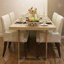 Shop our collection of leather dining room chairs at macys.com! Side View Of Top Wood Dining Table And White Leather Chair Stock Photo Picture And Royalty Free Image Image 16025049