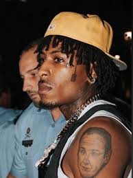 tf this nigga got a shovel tatted