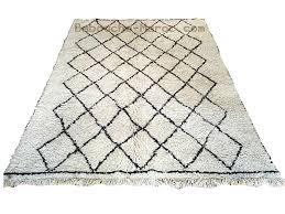 A thick heavy covering for a floor, usually made of woven wool or synthetic fibers, especially one covering the entire surface of the floor. Beni Ouarain Fatma Teppich Berber Teppiche