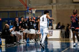 MEN'S BASKETBALL FALLS AT EMERSON, 86-58