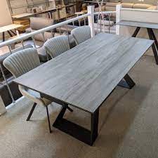 The form of a dining table matters a lot and gives a stylish look to the room. Kesterport Spartan Grey Wood Ceramic Extending Dining Table 6 10 Seater Extending Dining Tables
