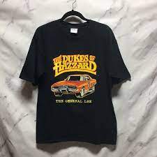 With a vintage inspired graphic, this tee features a distressed design featuring phrase keep rollin' with it with a retro style car. The Dukes Of Hazard Cotton Graphic Tee Boardwalk Vintage