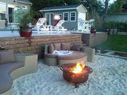 Why Bring Sand To The Beach When You Can Bring The Beach To You Here Are 20 Creative Beach Style Outdoor Living Backyard Beach Backyard Fire Fire Pit Backyard