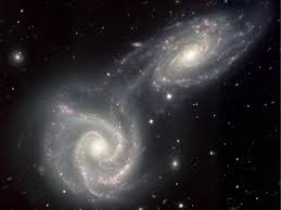 Due to a discrepancy between the density of matter which responds to electromagnetic radiation and the average calculated density of matter in the universe. Astronomers Just Found A Strange Galaxy Containing No Dark Matter