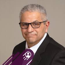 Picture: Father Fouad Saba receives gift of white cassock belonging to the  late Fr. Michael Husson, and previously received his Cross in 2016. Both  were gifted by Archdeacon David B Nimer and