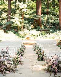 Check out this outdoor wedding ceremony with flower arch backdrop and see more inspirational photos on theknot.com. 20 Ways To Decorate A Wedding Ceremony Held Beneath Trees Martha Stewart