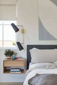 Floating Nightstand In The Bedroom With A Modern Black 2 Light Sconce Over The Nightstand Larg Modern Bedroom Interior Neutral Bedroom Decor Bedroom Interior
