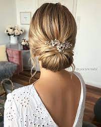 With A Veil Pinned Under Bun Hair Styles Bridal Hair Updo Bride Hairstyles