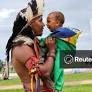Indigenous people take part in a march titled 'Lula, demarcate', during the Acampamento Terra Livre (Free Land) camp, in Brasilia