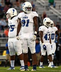 Fort Dorchester's big defensive end leans