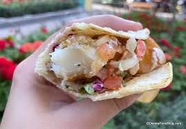 Blackened fish, chile lime sauce, shredded cabbage mix, topped with pineapple relish. Tacos The Disney Food Blog