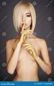 Elegant Nude Asian Woman with Gold Flowing Down Her Hands Stock Image -  Image of beauty, figure: 113305297